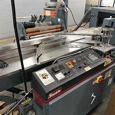 Shrink wrapping machine