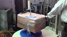 Shrink wrapping machine